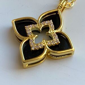 Black Enamel Quatrefoil Flower Pendant Necklace with Crystal Accents